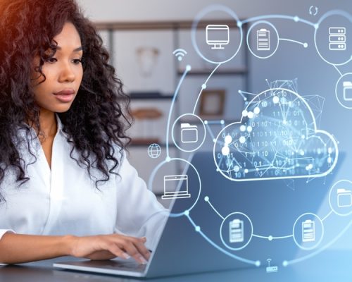 Black,Woman,Using,Laptop,,Cloud,Service,Hologram,Icons,,Files,Share